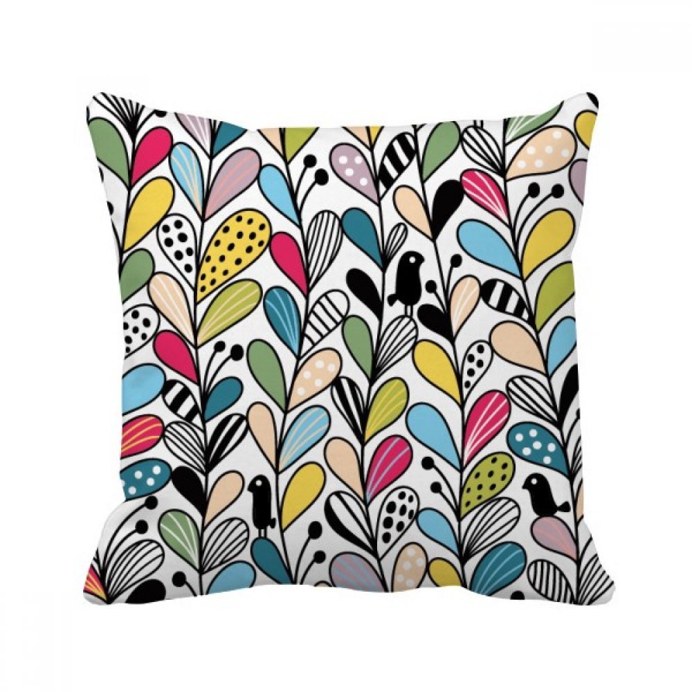 Oreiller de salon avec feuilles multicolores pour créer un coin lecture cosy
