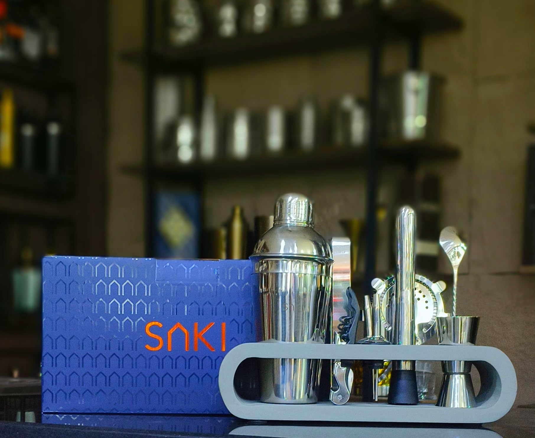 - SAKI|10 Piece Bartender kit (Cocktail Shaker Gift Set with Gray Stand), Bartender Kit: Shaker, Spoon, Jigger, Muddler, Strainer, Wine & Beer Bottle Opener, Pour Spouts & Tongs (with Colour Box)