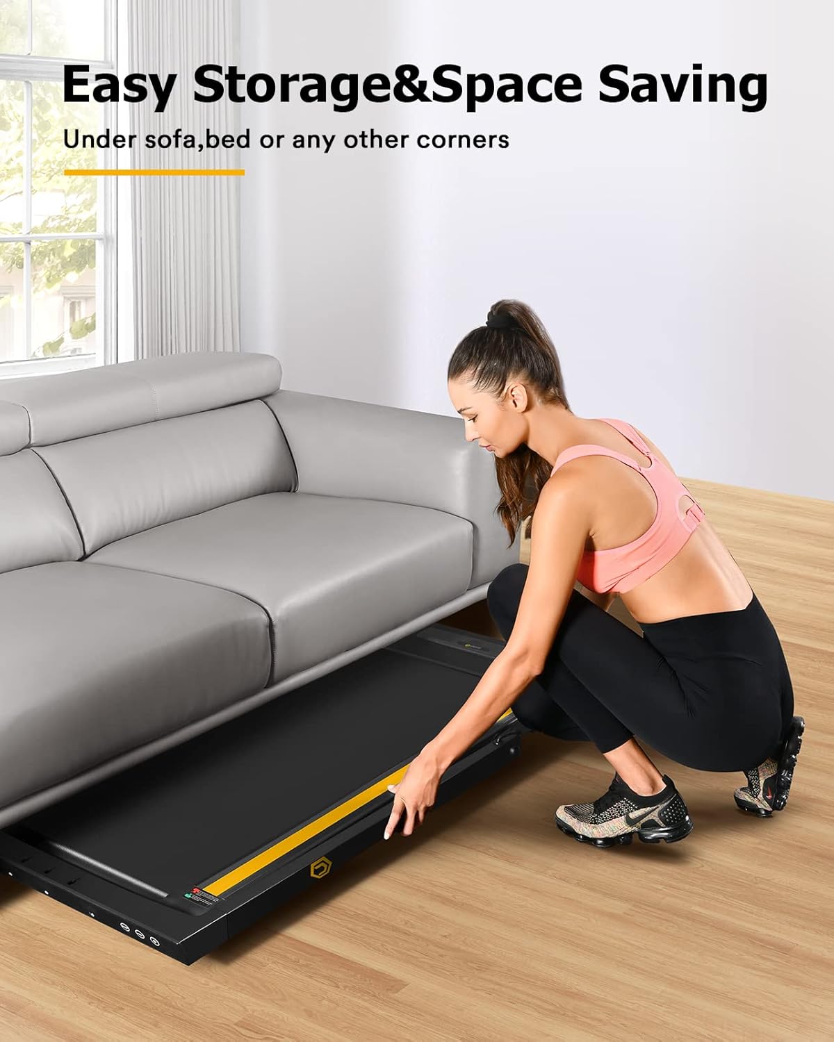 UREVO URTM030 Treadmill being stored under a sofa