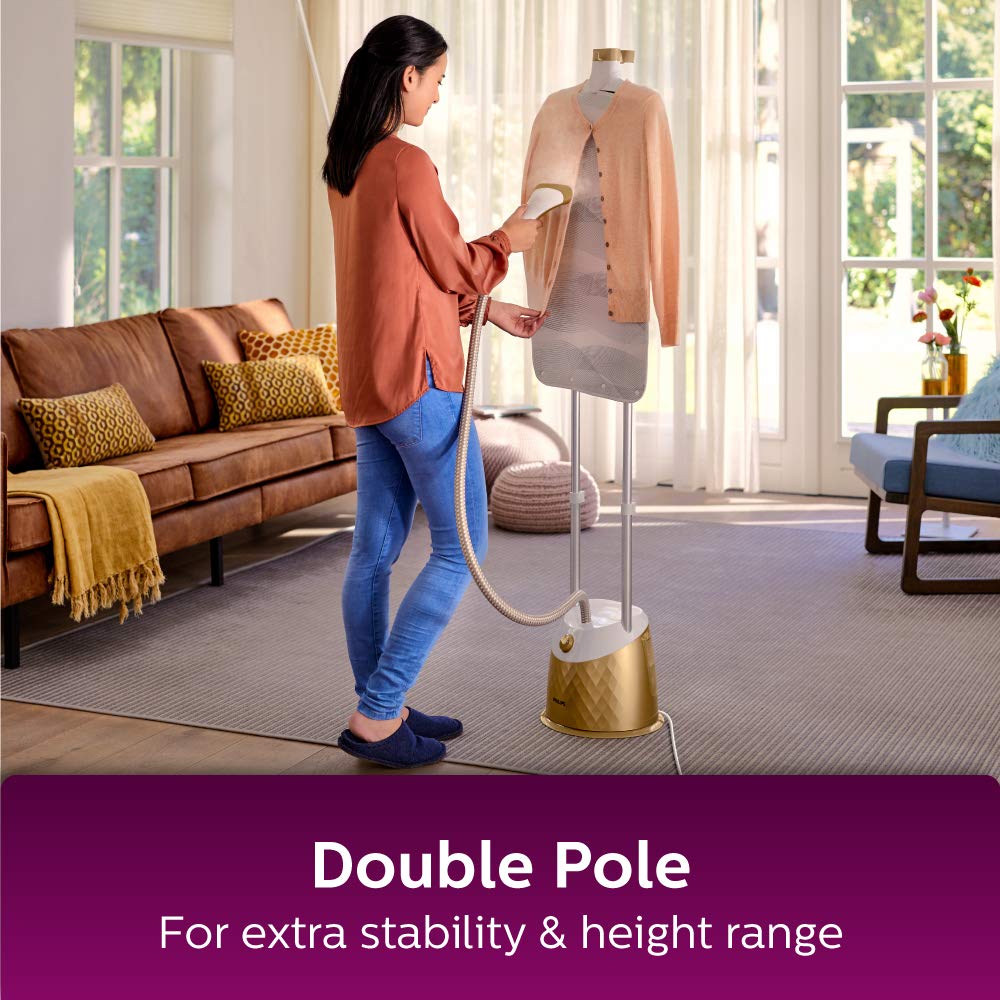 Person using the steamer, showing the double pole for stability and height adjustment.