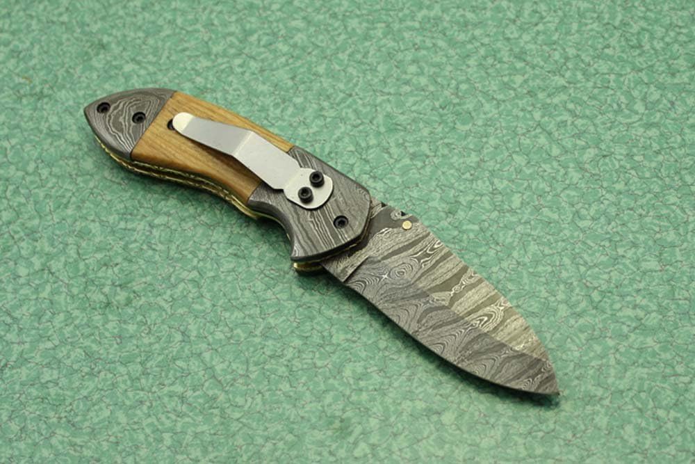 7 Inch Long Hand Forged Damascus Steel Folding Knife, Natural Wood, Camel Bone, Bull & Ram Horn Scales with Damascus Bolster, Equipped with Liner Lock and Thumb knob, Cow Hide Leather Sheath