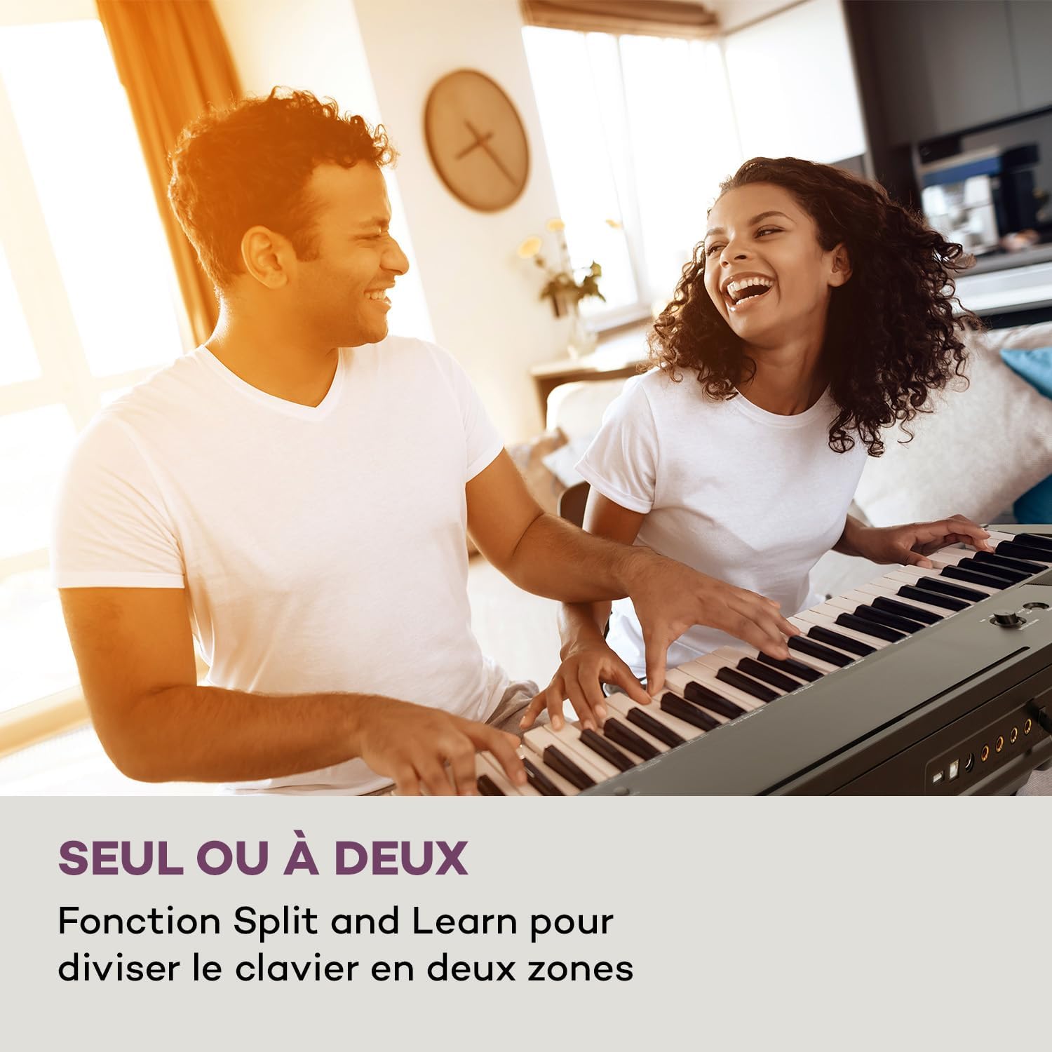 Two people playing the Schubert Preludio Keyboard, illustrating the Split and Learn function for shared playing.