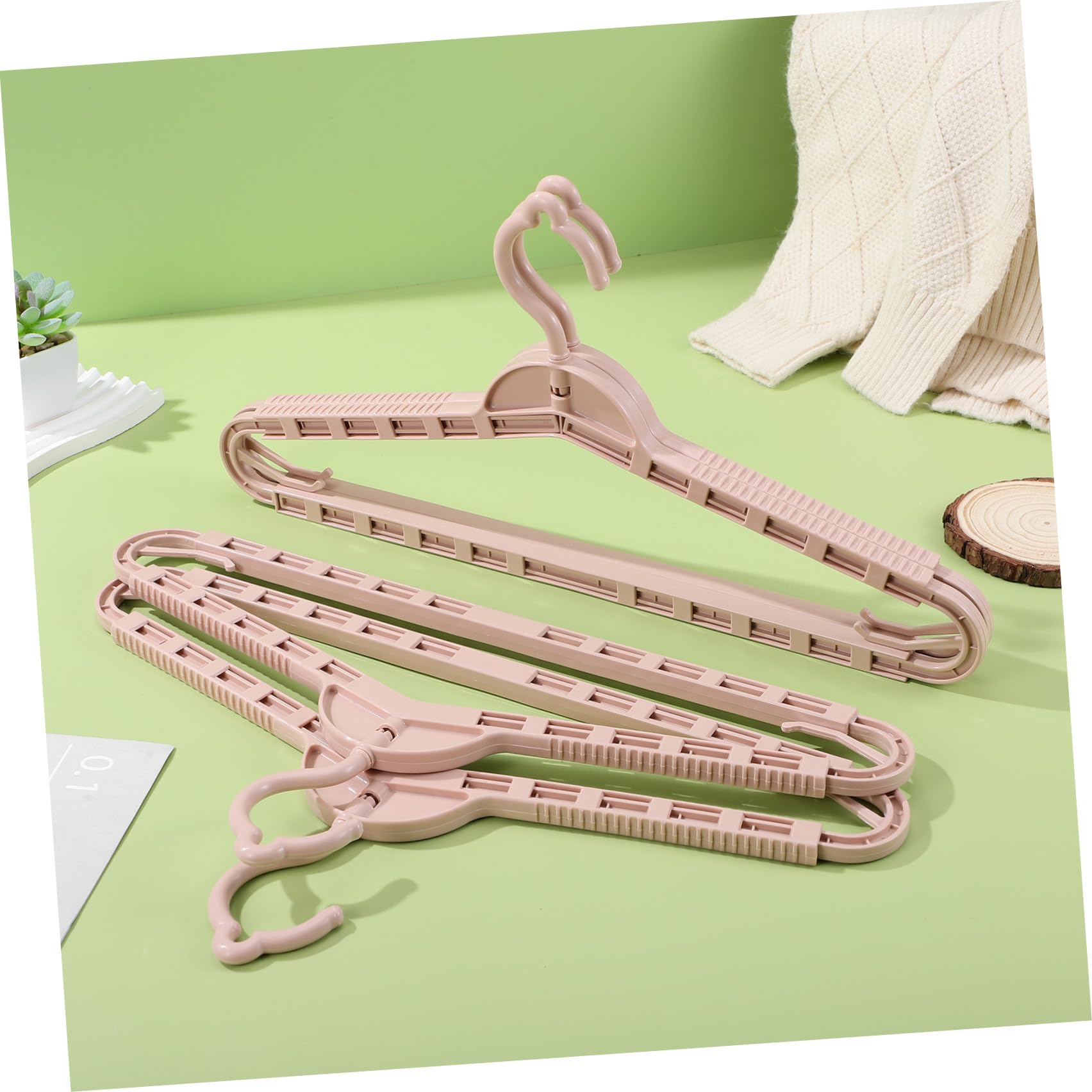 Perchas Retráctiles y Diseño Elegante Estructura Resistente Juego de 8 en Color Rosa Ideales para Organizar Armarios para Ropa de PP en Casa