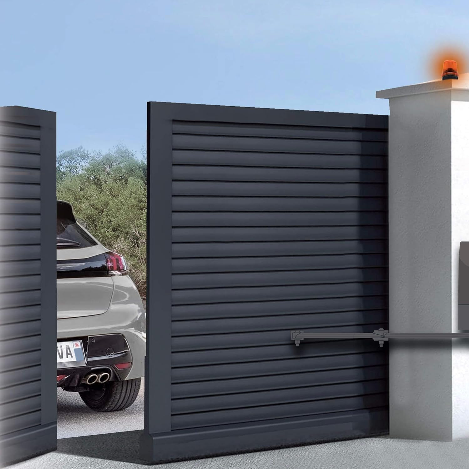 An automatic gate opening to allow a car to pass through.