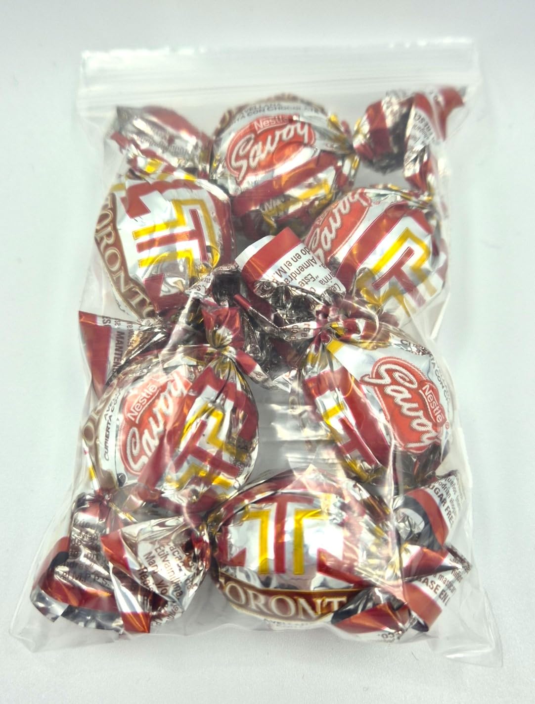 SAVOY TORONTO Noisette recouverte de chocolat de Savoy. Sachet de 60 g avec 6 chocolats
