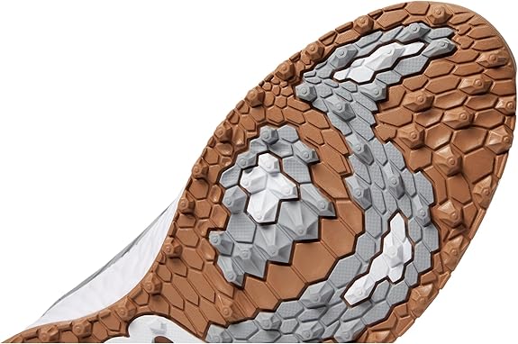 The New Balance Men's Fresh Foam Contend V2 Golf Shoe is designed to provide golfers with the ultimate combination of comfort and performance on the course. The shoe features a Fresh Foam midsole that offers cushioning and support, reducing fatigue and allowing for a more comfortable round of golf. The shoe also has a durable rubber outsole that provides traction and stability during swings and walks on the course.