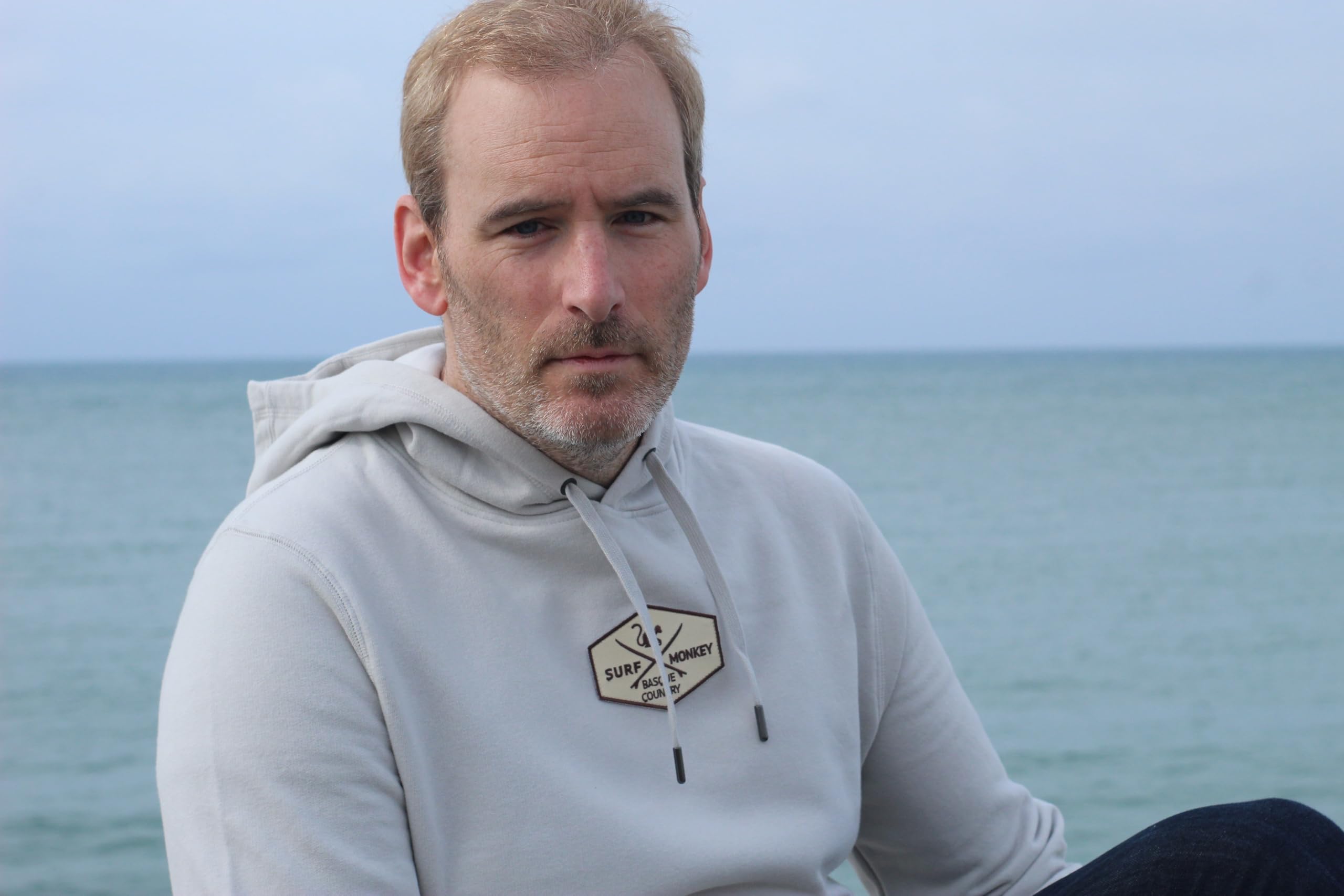 Surf Monkey Sudadera con Capucha y Bolsillo Canguro Hombre/Mujer - Parche Central