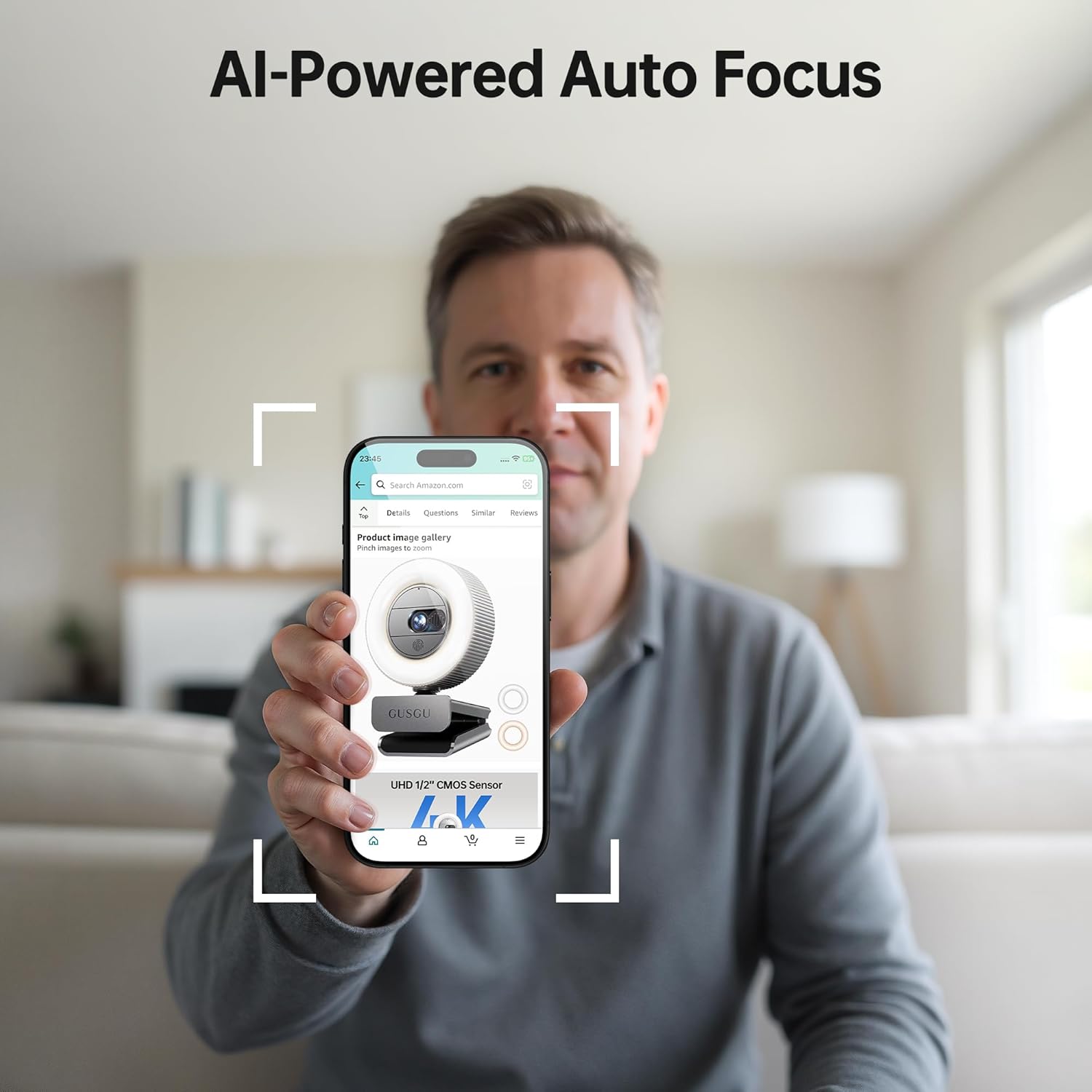 Man holding a phone displaying the GUSGU G910 Pro Webcam with AI-Powered Auto Focus