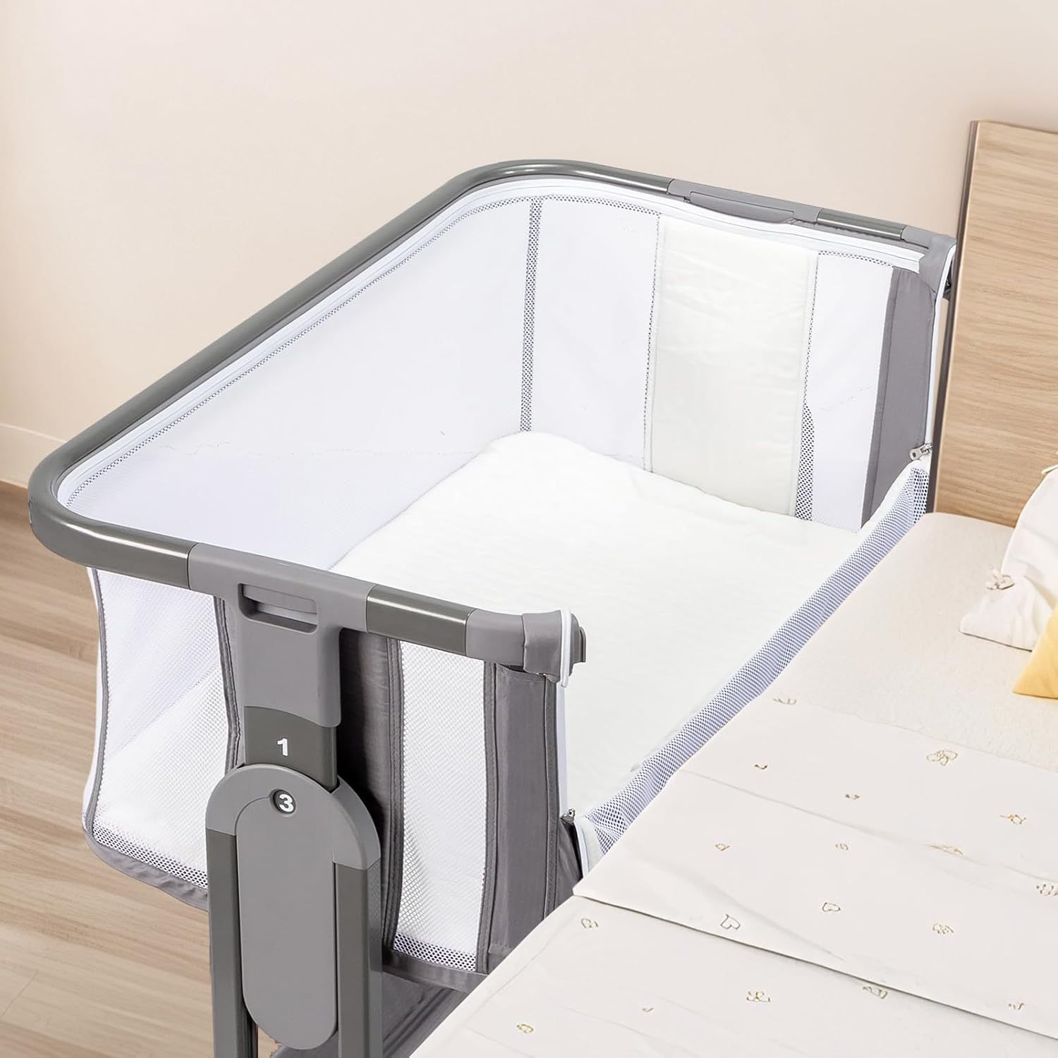 Bassinet attached to adult bed