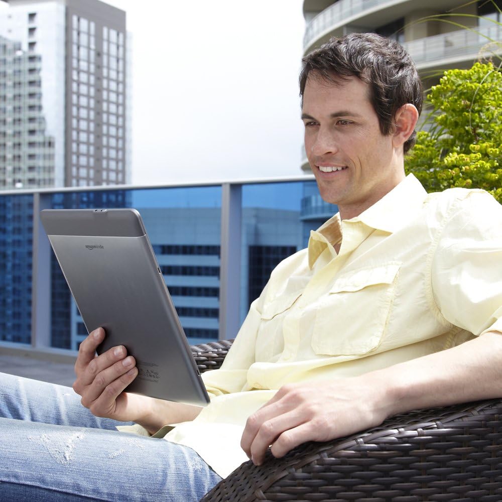 Person reading Kindle DX outdoors