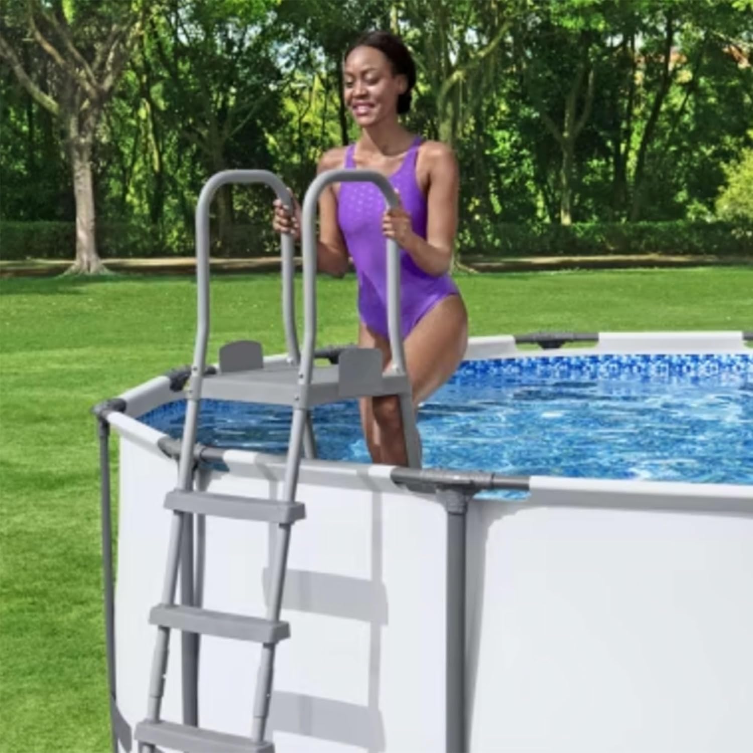 Woman exiting pool using ladder