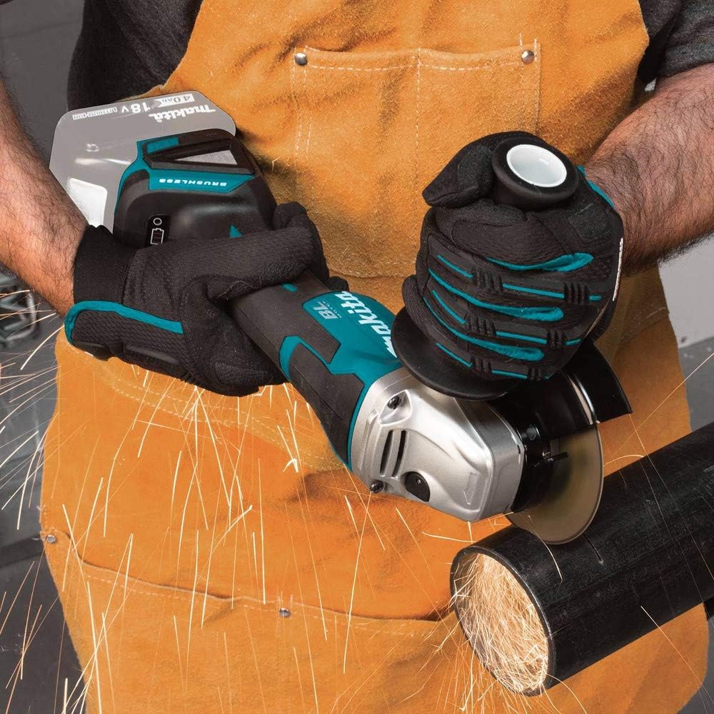 Makita XAG11Z Angle Grinder cutting a metal pipe