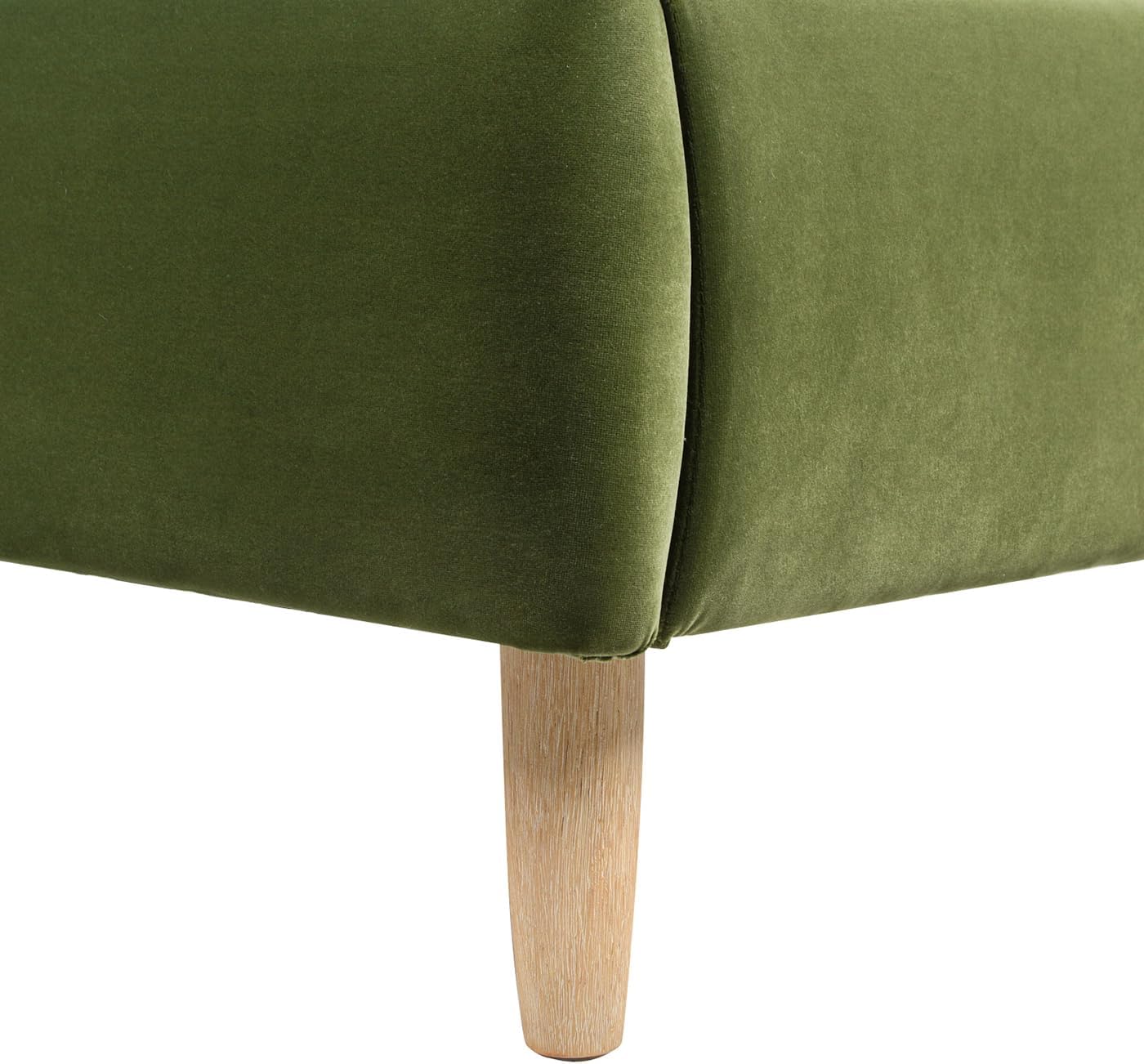 Close-up of a wooden bed leg attached to the upholstered bed frame.