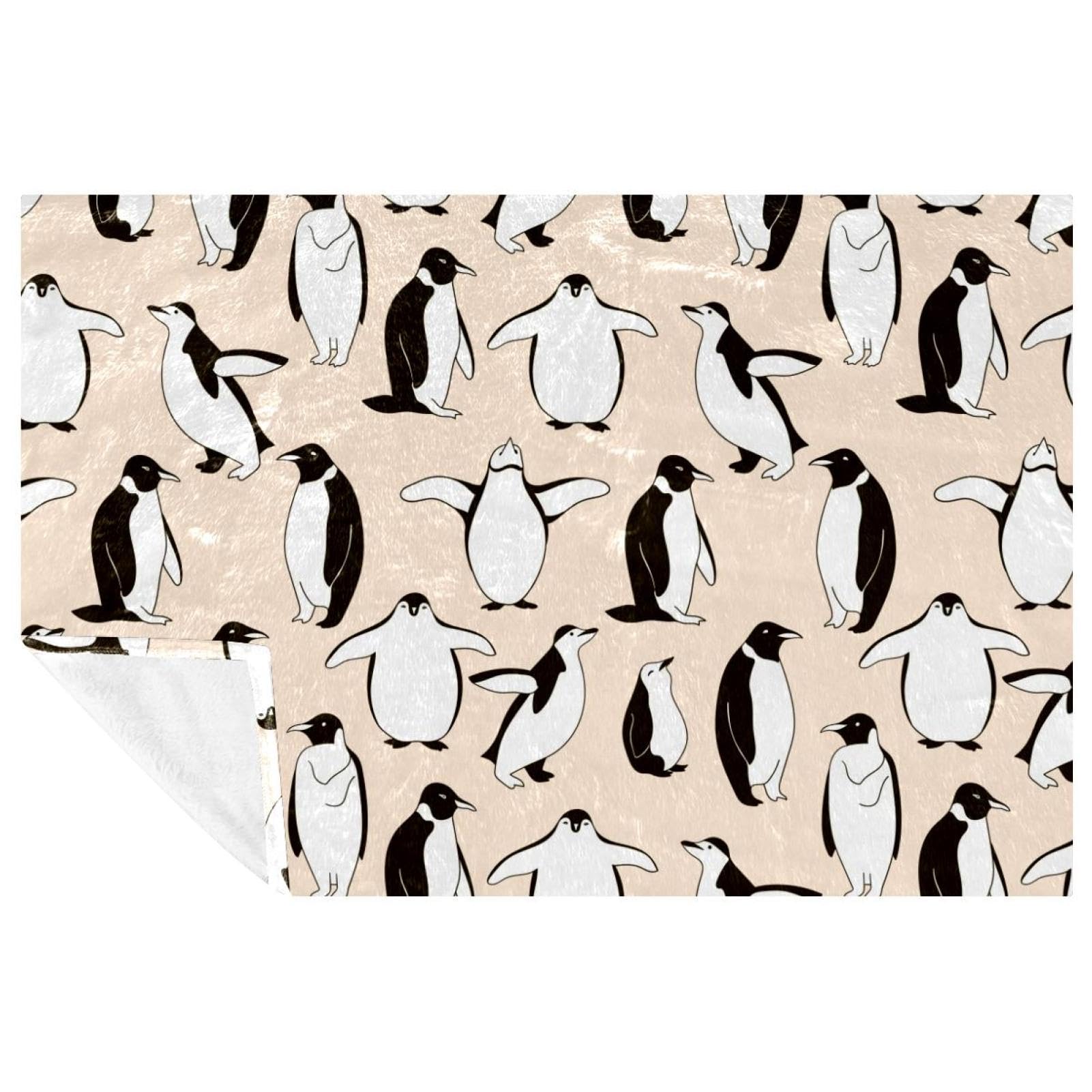 Couverture pingouin contre les soirées fraîches sur le canapé ou au lit