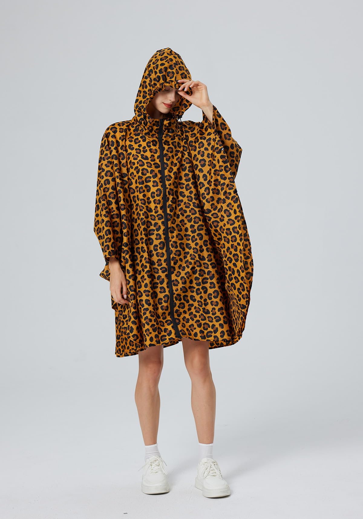 Poncho de pluie élégant imperméable avec capuche et fermeture éclair.