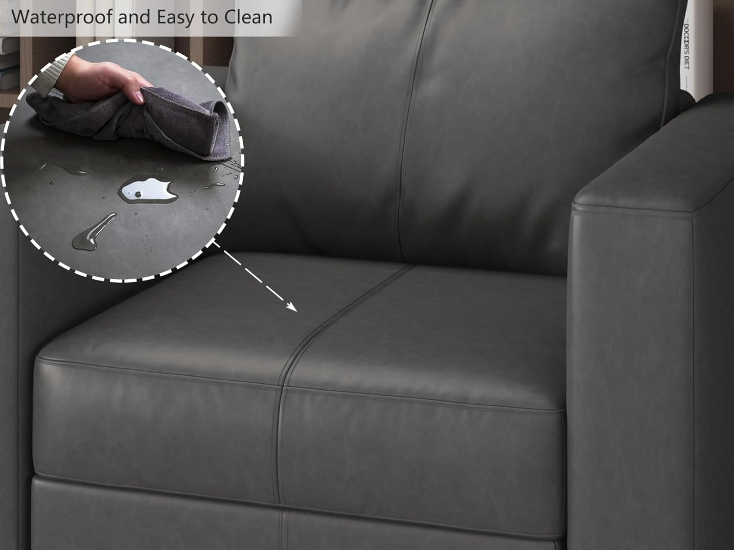 Close-up of water droplets on faux leather sofa, being wiped clean