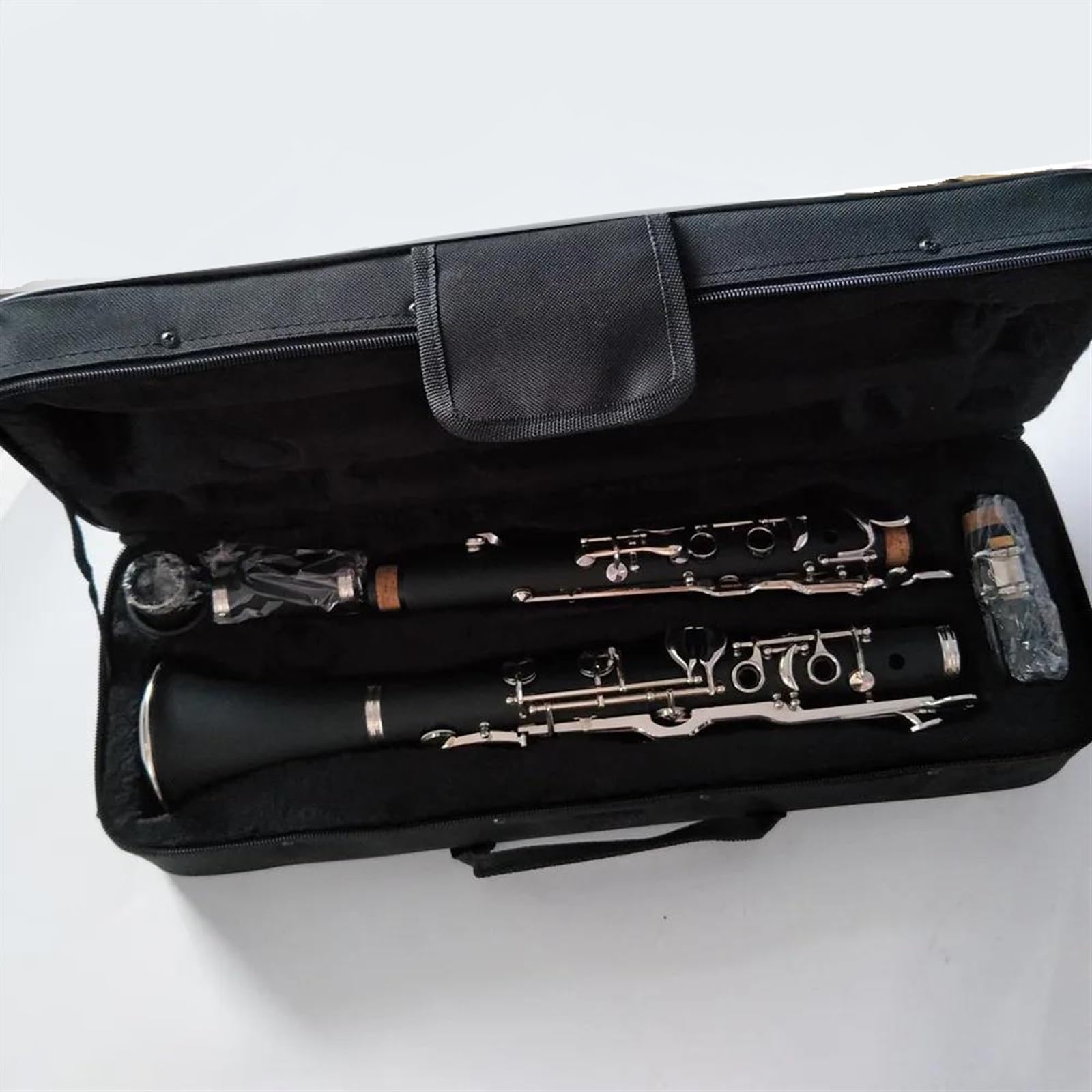 Instrumento de clarinete de 18 teclas en tecla G Cuerpo de baquelita Superficie niquelada Clarinete Profesional