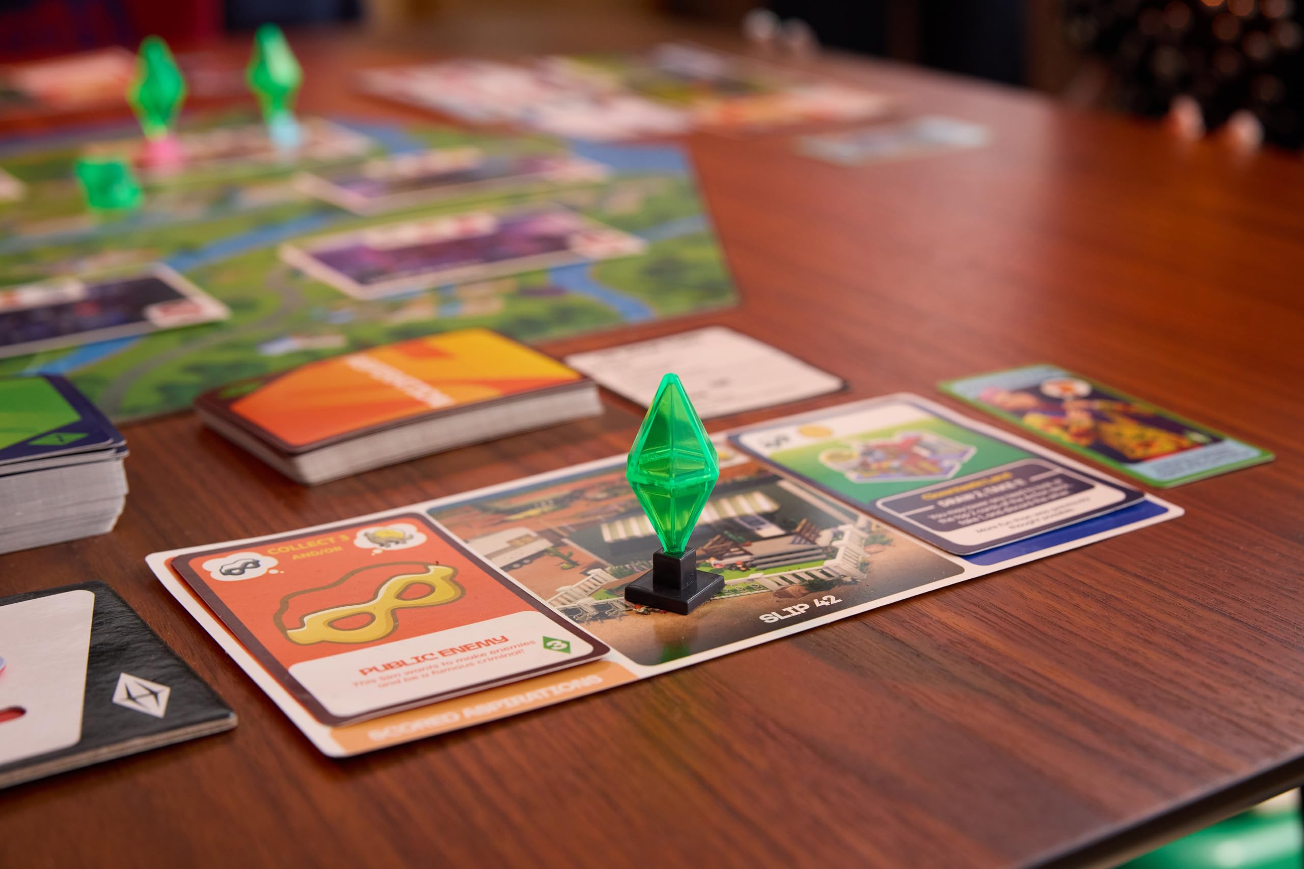 Goliath Games Prezentuje: The Sims - Gra Planszowa | Zarządzaj Twoimi Potrzebami i Realizuj Swoje Aspiracje! | Na podstawie popularnej serii gier | Gry planszowe dla dorosłych | Dla 2-5 graczy w wieku