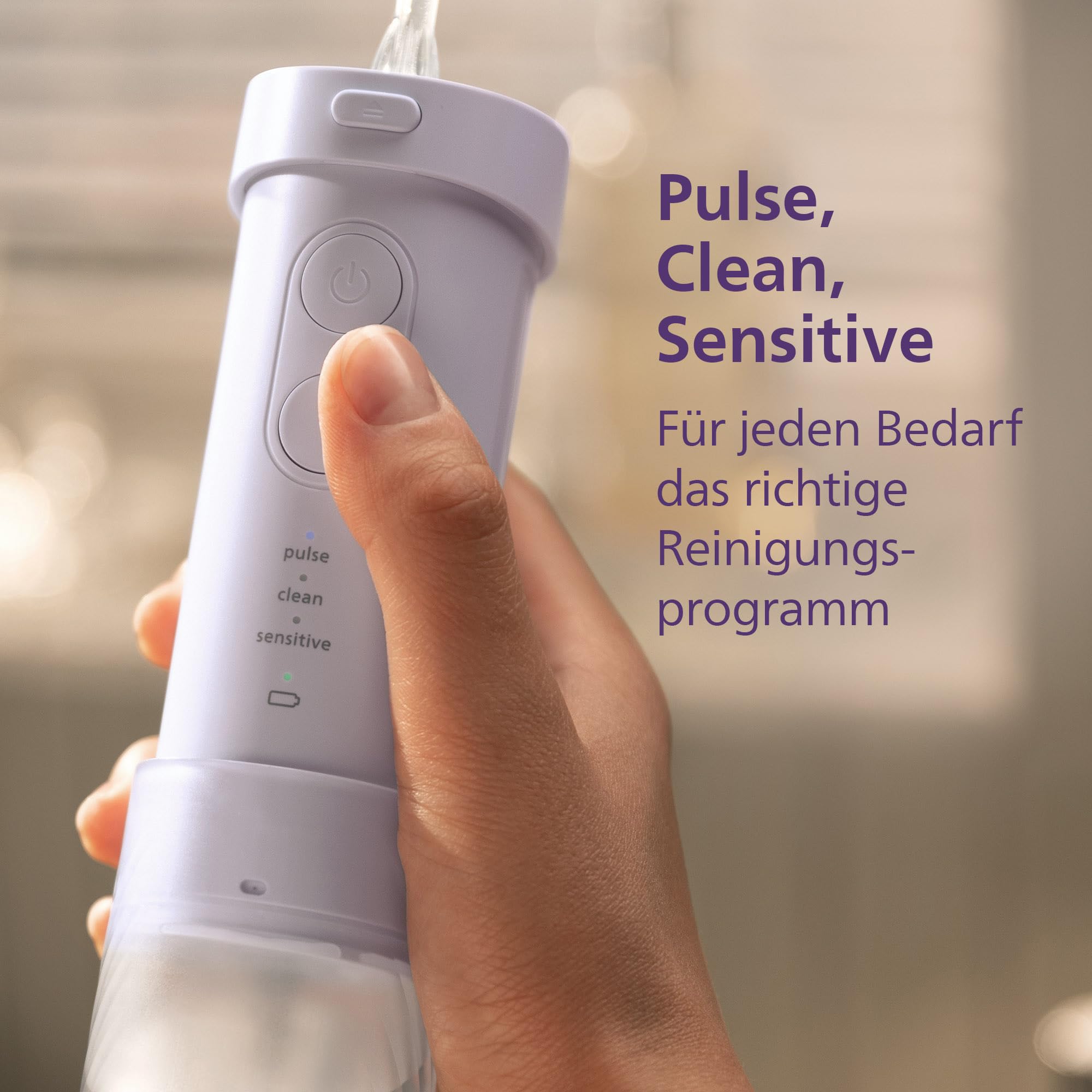 Philips Sonicare Compact Flosser 1000, tragbare Munddusche mit 3 Reinigungsprogrammen, IPX7 wasserdicht, reisefreundlich, Lila, Modell HX3333/23