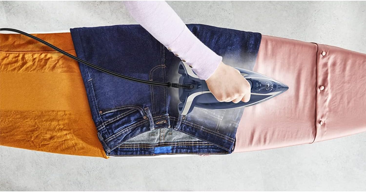 Tefal Smart Protect Plus FV6872 Steam Iron in use, ironing jeans and silk