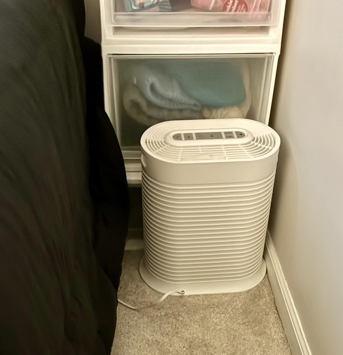 Honeywell HPA200 air purifier in bedroom setting showing compact profile