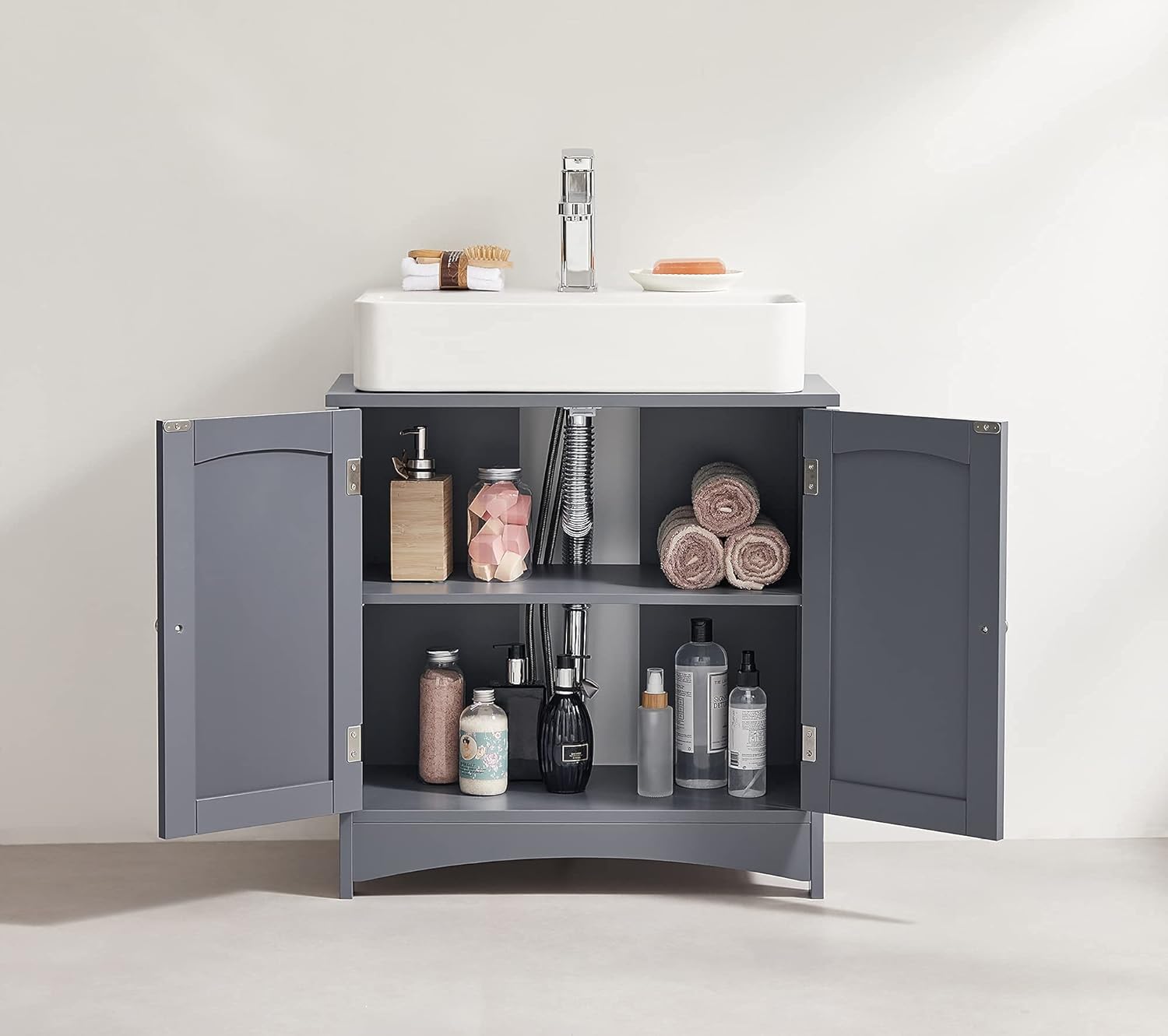 Cabinet interior with adjustable shelf and stored items