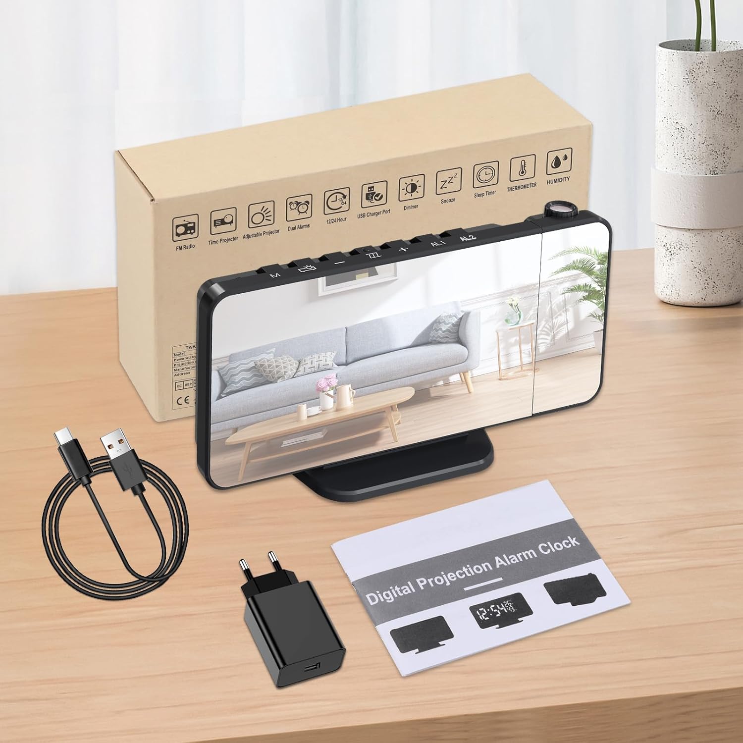 Package contents of the TAKRINK Digital Projection Alarm Clock, including the clock, USB cable, power adapter, and manual.