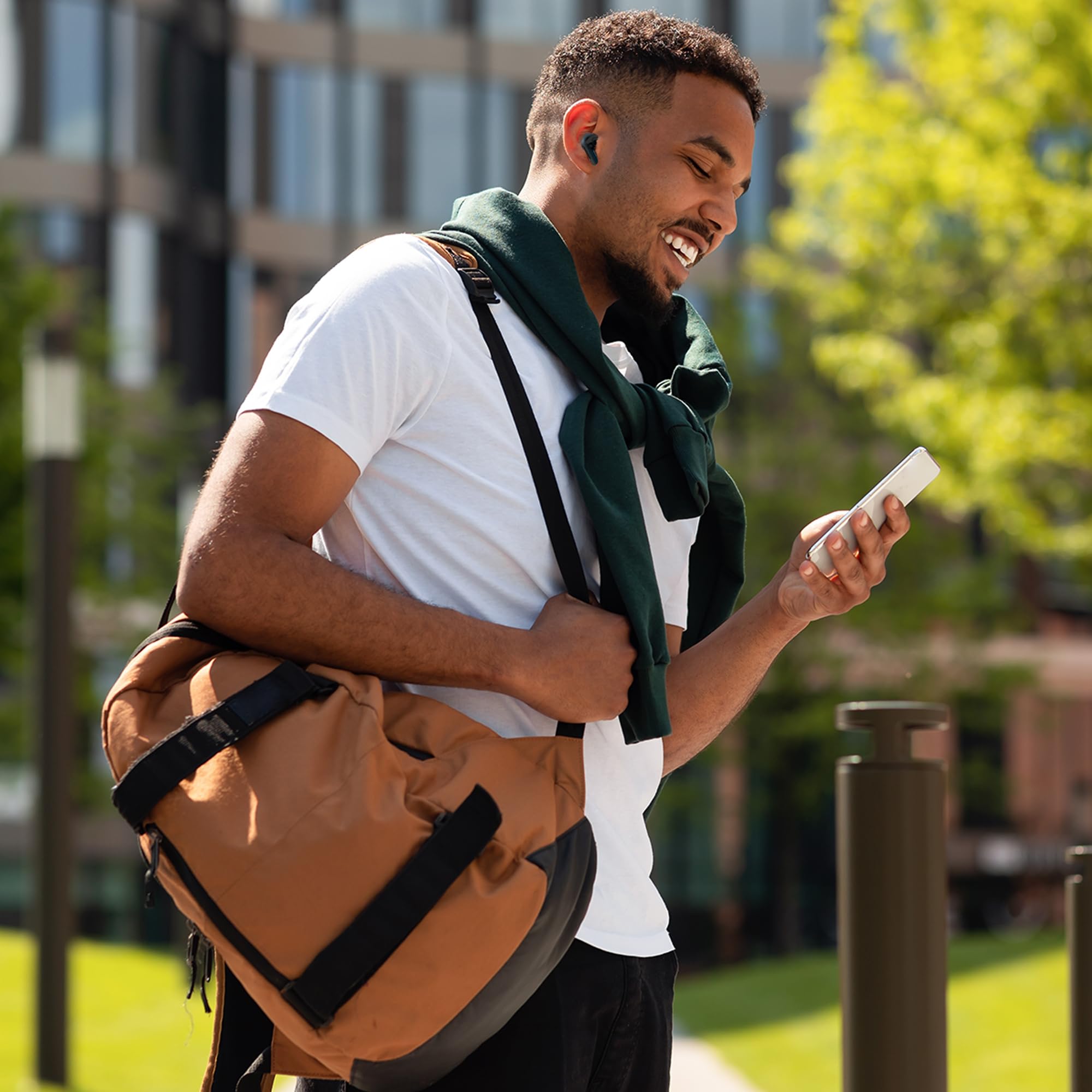 Person demonstrating tap controls on an earbud