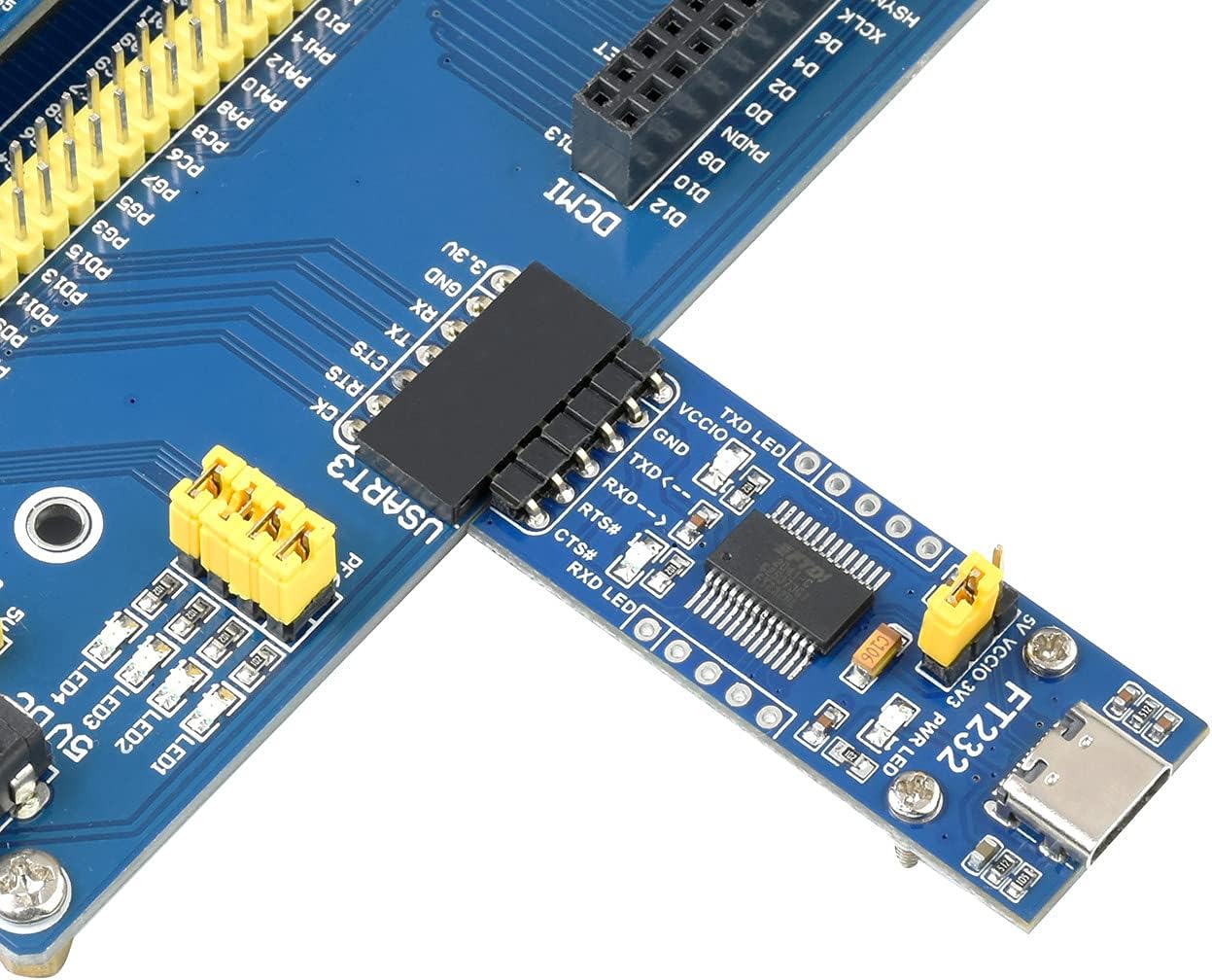 The FT232RL USB to TTL Adapter Board connected to a larger development board, illustrating typical hardware connections for serial communication.