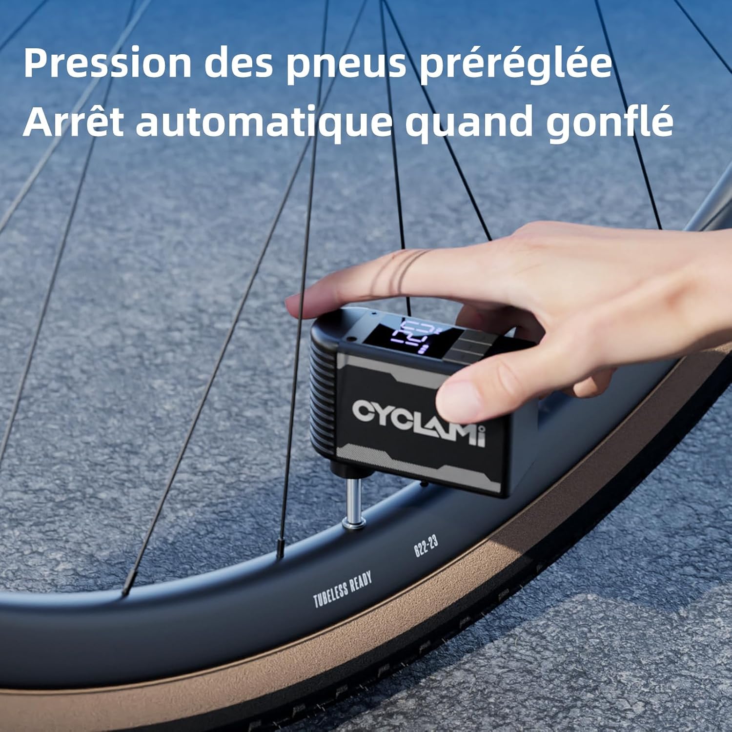 CYCLAMI A2S pump inflating a bicycle tire, showing the digital display with preset pressure and automatic stop function.
