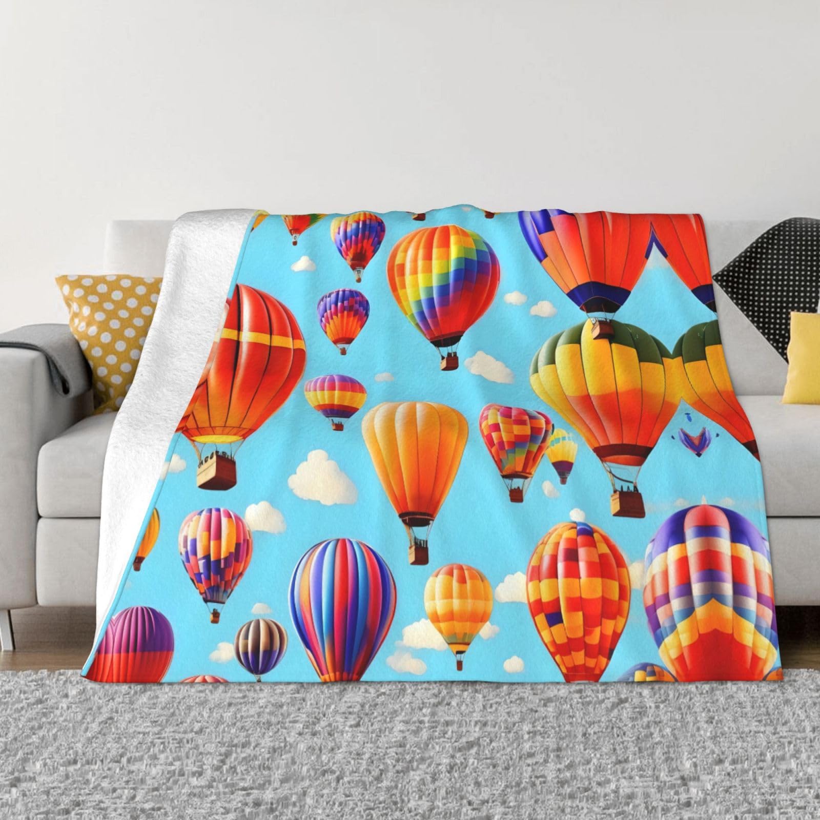 Couverture polaire montgolfière pour soirées cocooning sur le canapé
