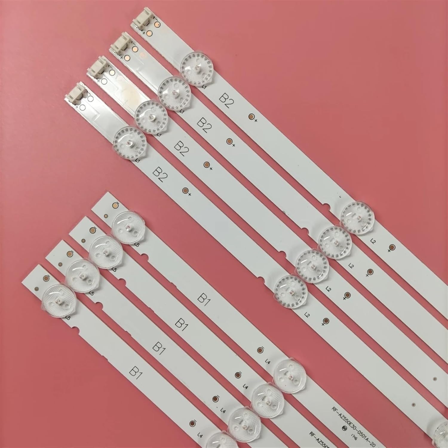 Close-up view of two types of LED backlight strips, labeled B1 and B2, showing their individual LEDs and connectors.