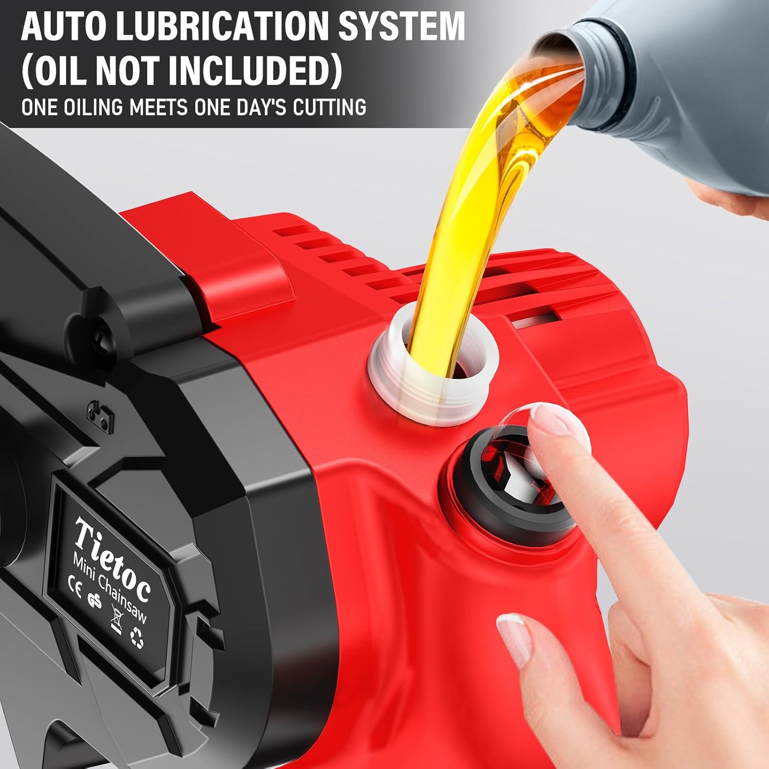 Close-up of a hand pouring oil into the automatic oiler system of the mini chainsaw.