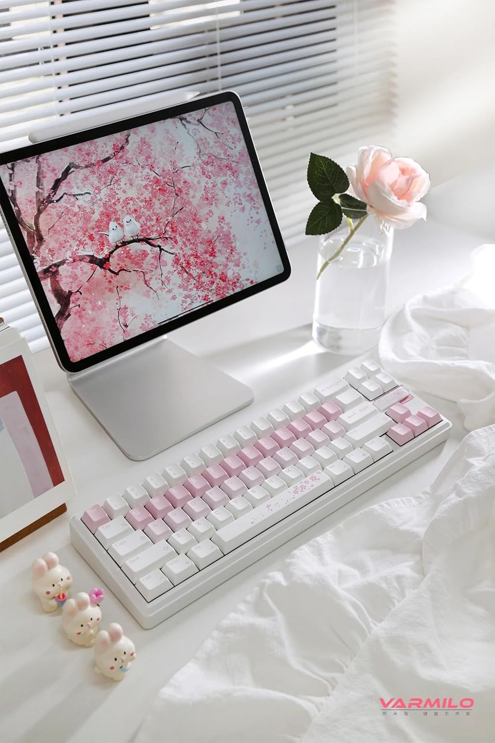 നിറഞ്ഞു view of the Varmilo Sword68 keyboard on a desk with a tablet displaying a Sakura image.