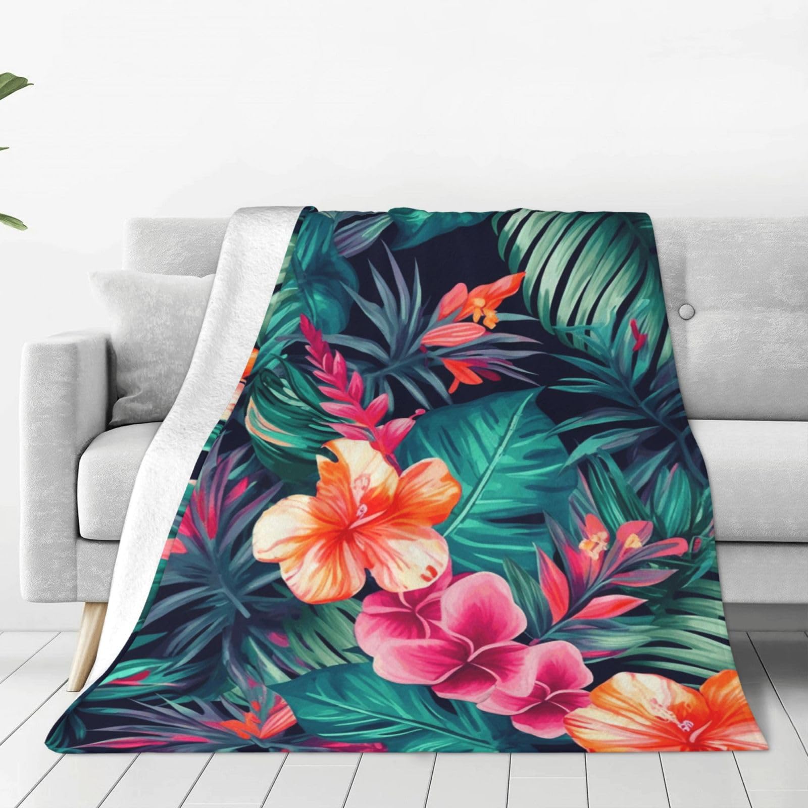 Couverture réversible douce motif feuilles tropicales : le plaid canapé et camping idéal