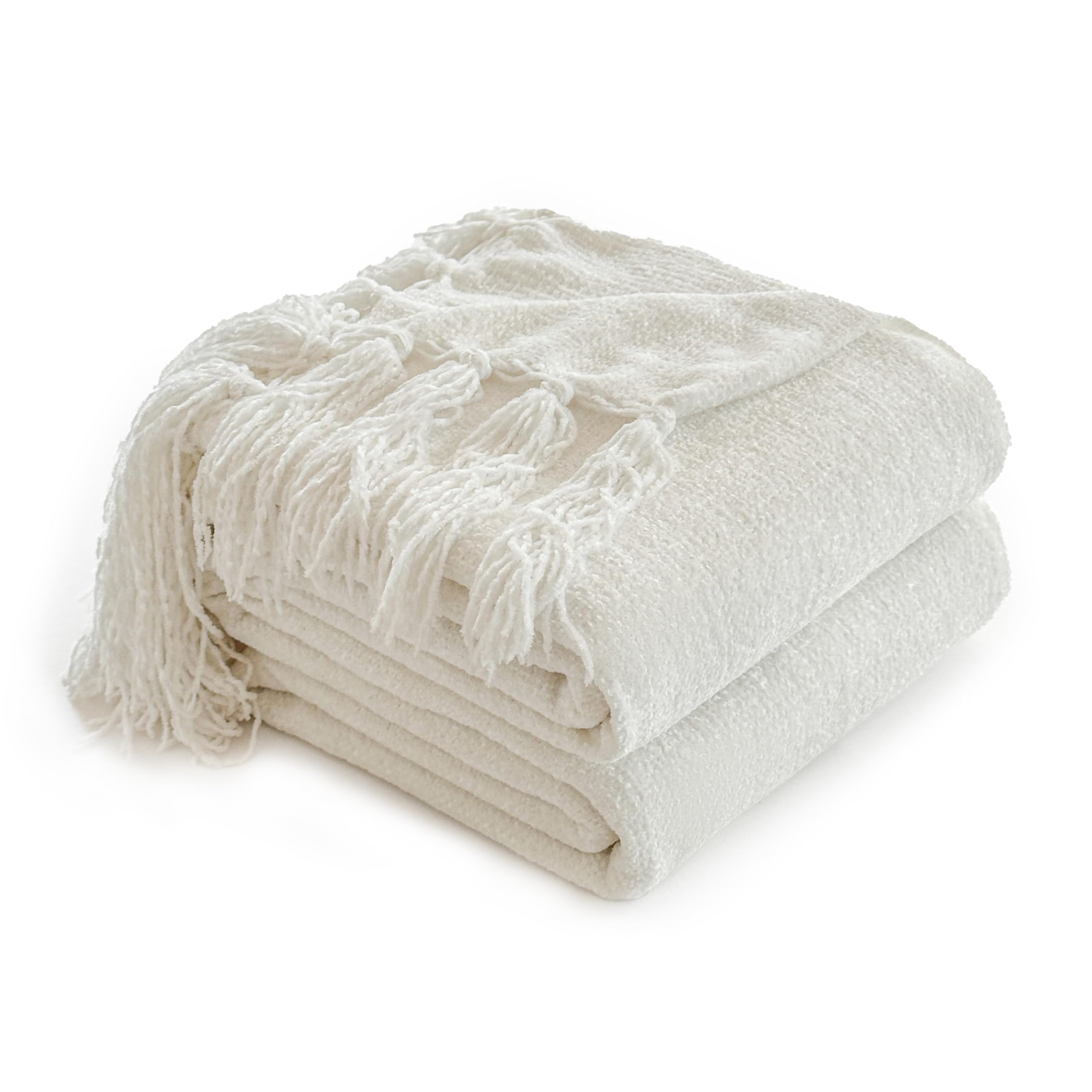 Couverture en chenille bohème crème pour sublimer les soirées cocooning au salon