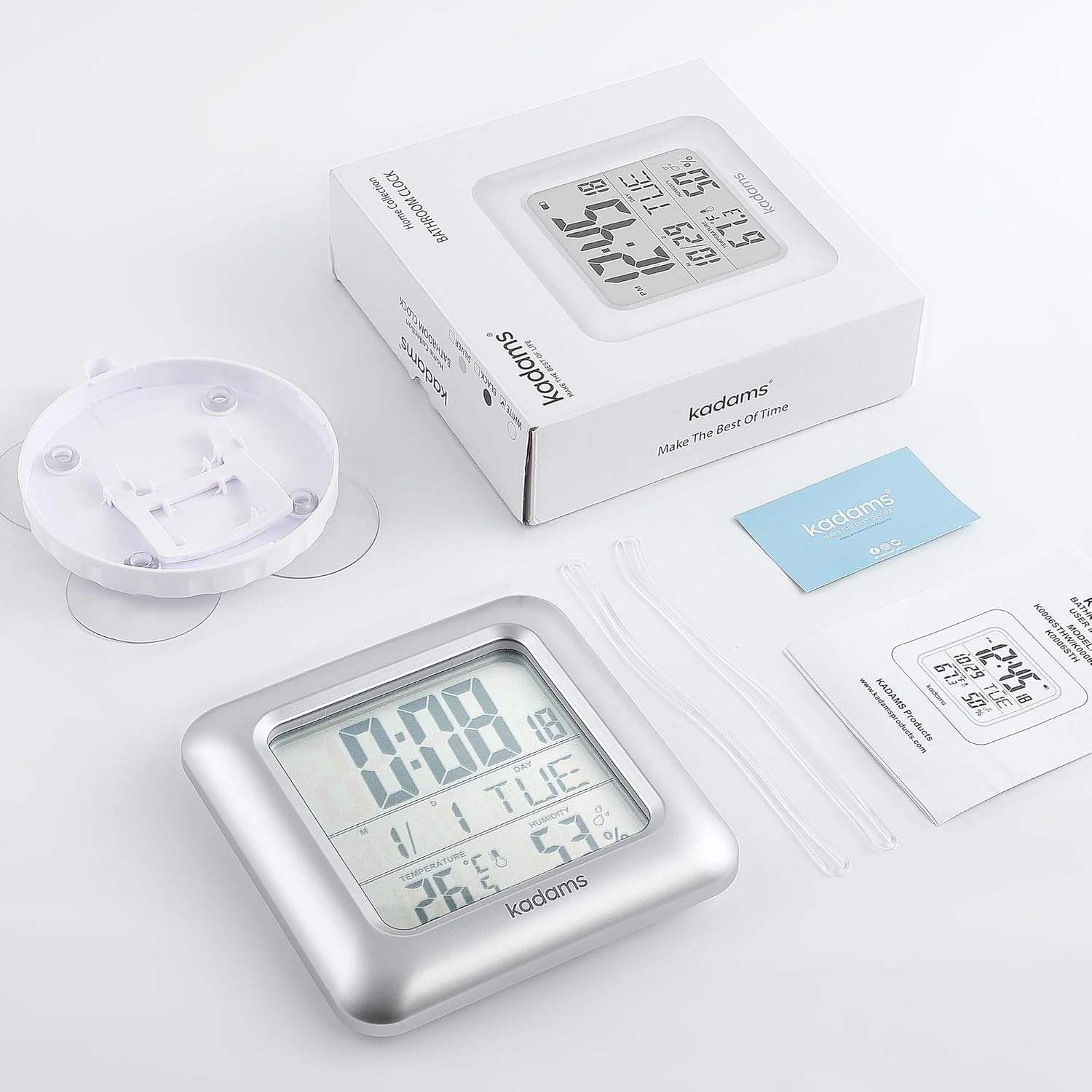 KADAMS Bathroom Clock, its packaging box, user manual, PVC hanging rope, and suction cup lid with integrated stand, laid out on a white surface.