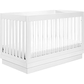white crib with clear bars