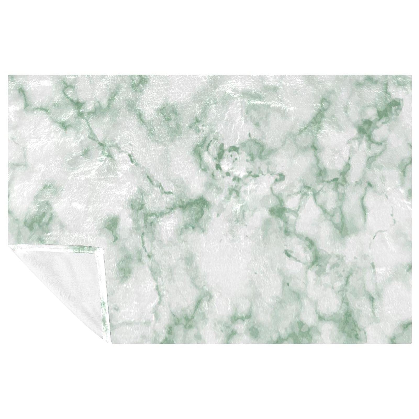 Couverture chaude marbre vert contre les courants d'air sur le lit et le canapé