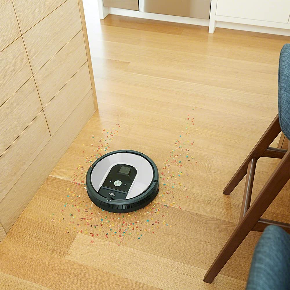 iRobot Roomba 971 cleaning up spilled cereal near an Amazon Echo device