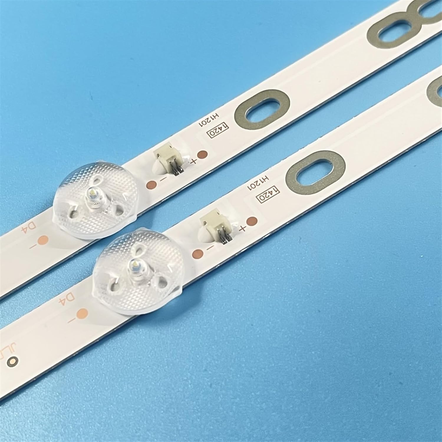 Close-up of an LED backlight strip showing individual LEDs and electrical connectors