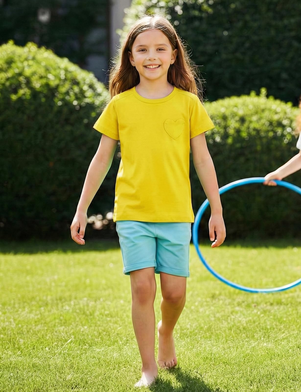 Spring&Gege T-shirt à manches courtes pour fille en coton col rond T-shirt de sport décontracté avec poche en forme de cœur pour l'été Couleur unie Hauts décontractés