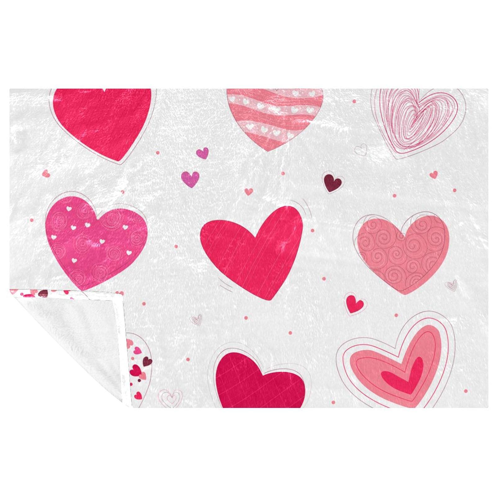 Couverture douce à motifs cœurs pour créer un nid douillet chez vous