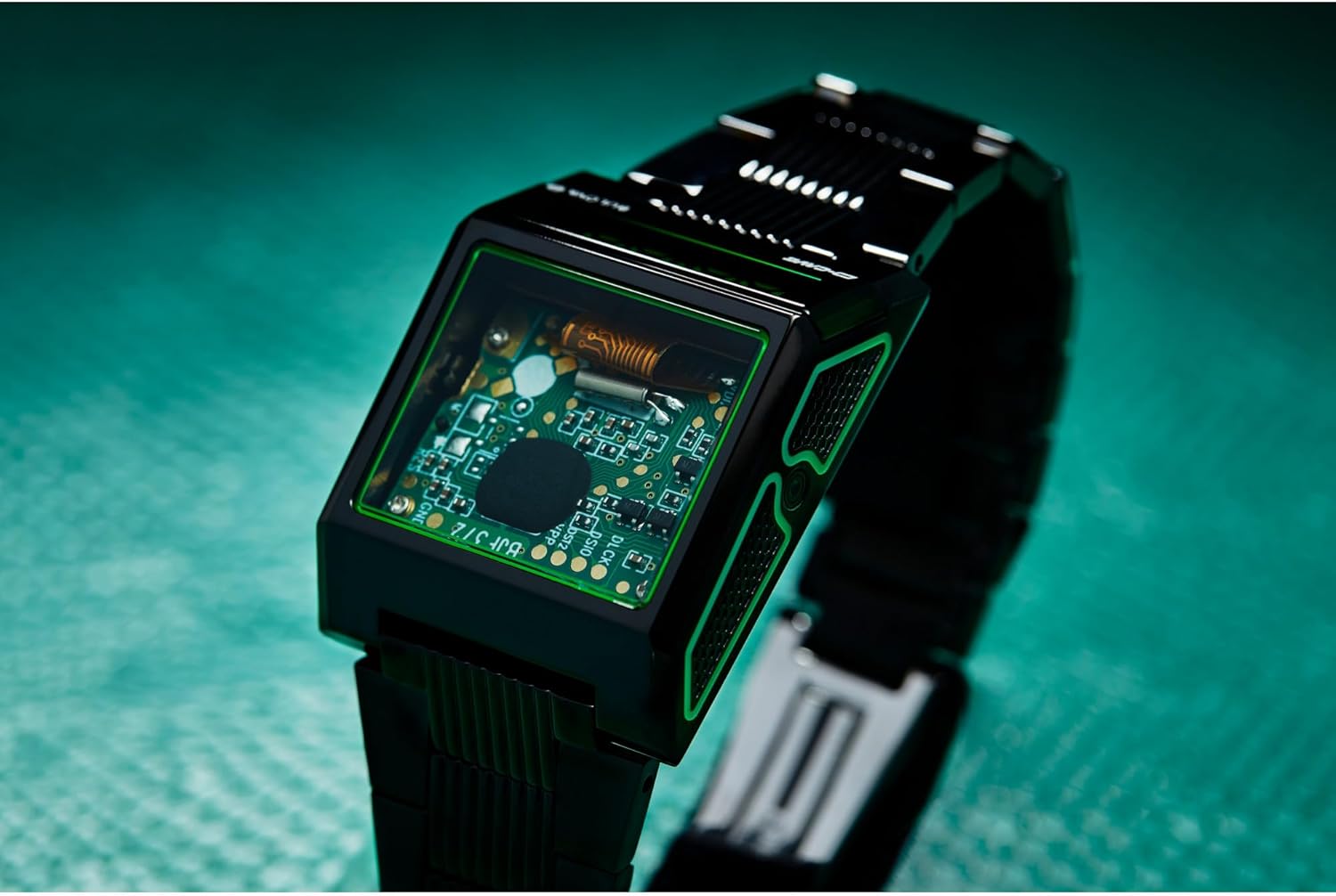 Ongl view of the Bulova Computron D-Cave watch on a textured surface, highlighting the transparent crystal and internal circuit board.