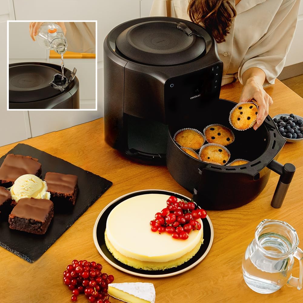 Cecotec Cecofry Rain deep fryer with muffins, showing an inset of water being poured into the top reservoir for self-cleaning.
