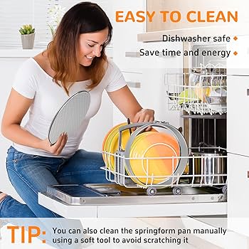 A Person Hand Washing A Springform Pan In A Sink With Soapy Water, Showing The Separate Pieces.