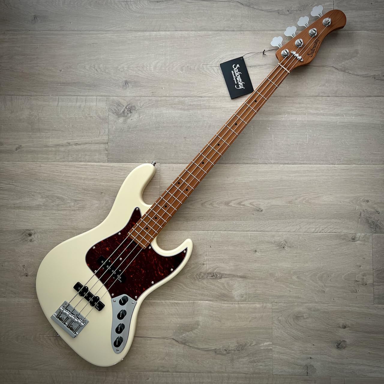 Close-up of the Sadowsky MetroExpress bass body, showing control knobs and pickups