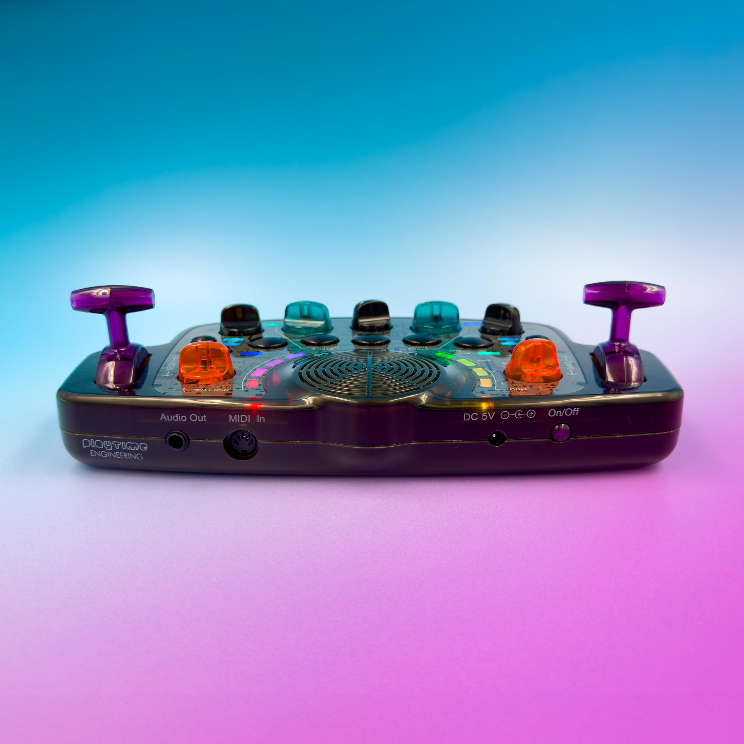 Side view of Blipblox After Dark Synthesizer showing Audio Out, MIDI In, DC 5V, and On/Off switch ports.