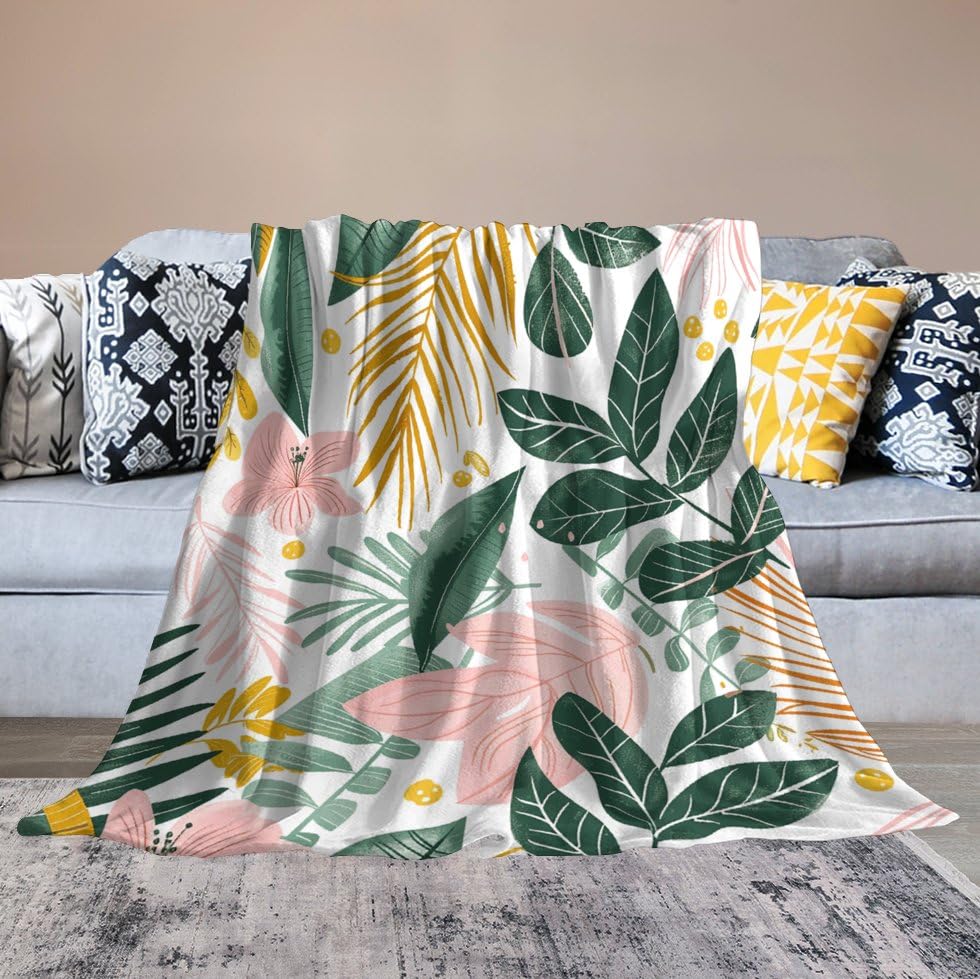 Couverture polaire doudou motif feuilles tropicales pour des moments cocooning