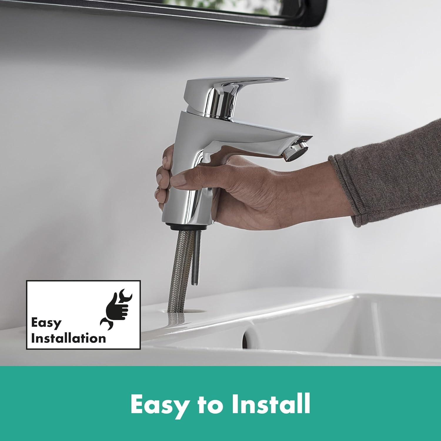 Image showing a hand installing the hansgrohe Logis Basin Mixer Tap into a sink